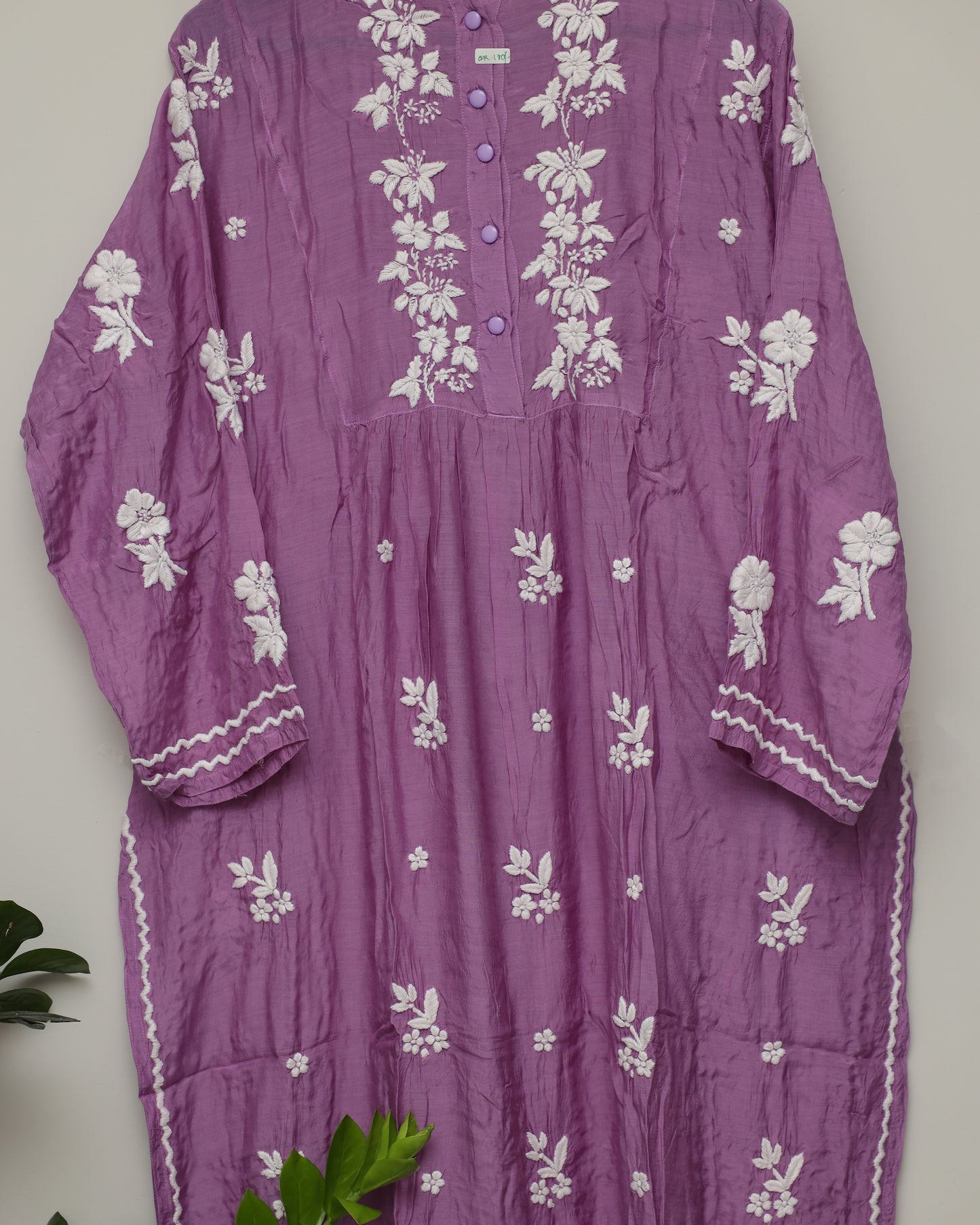 Chikankari on plum color with closed neck and curvey embossed borders