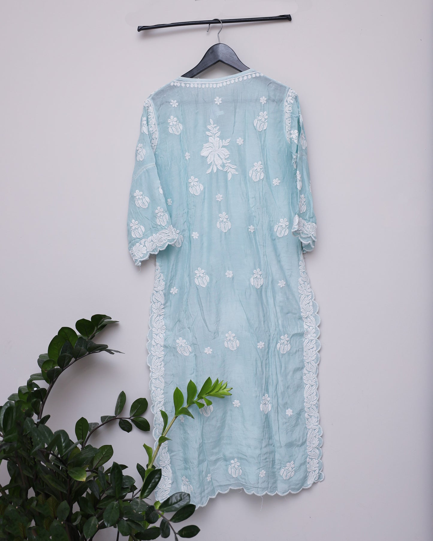 Cool Green silk chikankari handwork kurti with curves with the borders across the flow